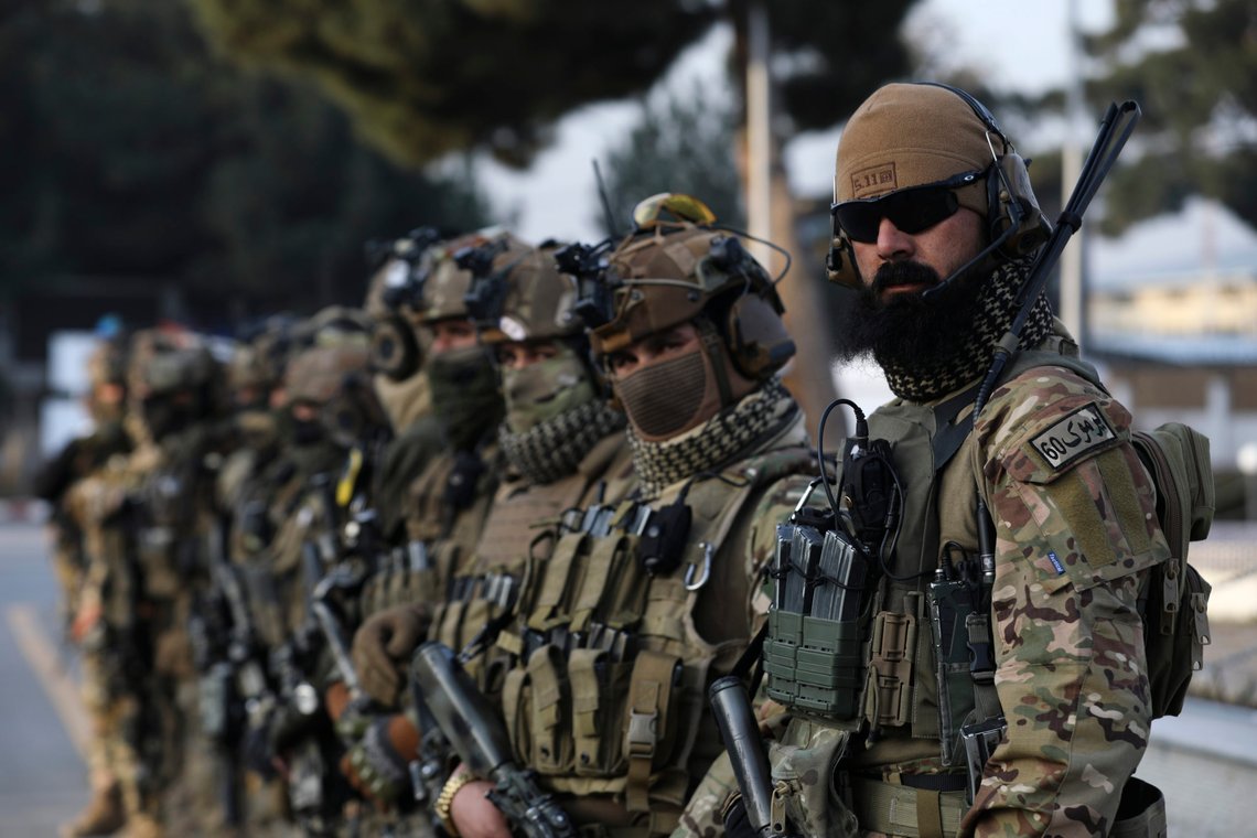 Taliban security personnel stand guard to receive Afghan prisoners who were held in U.S. custody at the Kabul international airport in Kabul, Afghanistan, Monday, Feb. 12, 2024. Two Afghan prisoners who were held in U.S. custody for at least 14 years at the Guantanamo Bay detention center after 2002 were released from house arrest in Oman, a Taliban spokesman said Sunday. (AP Photo/ Siddiqullah Alizai) Taliban security personnel stand guard to receive Afghan prisoners who were held in U.S. custody at the Kabul international airport in Kabul, Afghanistan, Monday, Feb. 12, 2024. Two Afghan prisoners who were held in U.S. custody for at least 14 years at the Guantanamo Bay detention center after 2002 were released from house arrest in Oman, a Taliban spokesman said Sunday. (AP Photo/ Siddiqullah Alizai)
