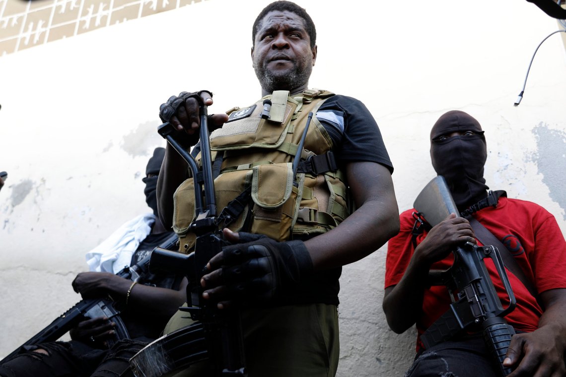 Barbecue, the leader of the "G9 and Family" gang, stands with his fellow gang members after speaking to journalists in the Delmas 6 neighborhood of Port-au-Prince in Port-au-Prince, Haiti, Tuesday, March 5, 2024. Haiti's latest violence began with a direct challenge from the former elite police officer Jimmy Chérizier, known as Barbecue, who said he would target government ministers to prevent the prime minister's return and force his resignation. (AP Photo/Odelyn Joseph) Barbecue, the leader of the "G9 and Family" gang, stands with his fellow gang members after speaking to journalists in the Delmas 6 neighborhood of Port-au-Prince in Port-au-Prince, Haiti, Tuesday, March 5, 2024. Haiti's latest violence began with a direct challenge from the former elite police officer Jimmy Chérizier, known as Barbecue, who said he would target government ministers to prevent the prime minister's return and force his resignation. (AP Photo/Odelyn Joseph)