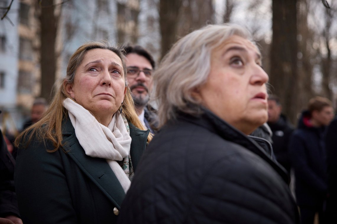 In this photo provided by the Ukrainian Presidential Press Office, people react in a place of Russian attack at a residential area on March 2, during a visit of Ukrainian President Volodymyr Zelenskyy and Greece's Prime Minister Kyriakos Mitsotakis, in Odesa, Ukraine, Wednesday, March 6, 2024. The sound of a large explosion reverberated around the Ukrainian port of Odesa as President Volodymyr Zelenskyy and Greece's prime minister ended a tour of the war-ravaged southern city Wednesday. (Ukrainian Presidential Press Office via AP) In this photo provided by the Ukrainian Presidential Press Office, people react in a place of Russian attack at a residential area on March 2, during a visit of Ukrainian President Volodymyr Zelenskyy and Greece's Prime Minister Kyriakos Mitsotakis, in Odesa, Ukraine, Wednesday, March 6, 2024. The sound of a large explosion reverberated around the Ukrainian port of Odesa as President Volodymyr Zelenskyy and Greece's prime minister ended a tour of the war-ravaged southern city Wednesday. (Ukrainian Presidential Press Office via AP)