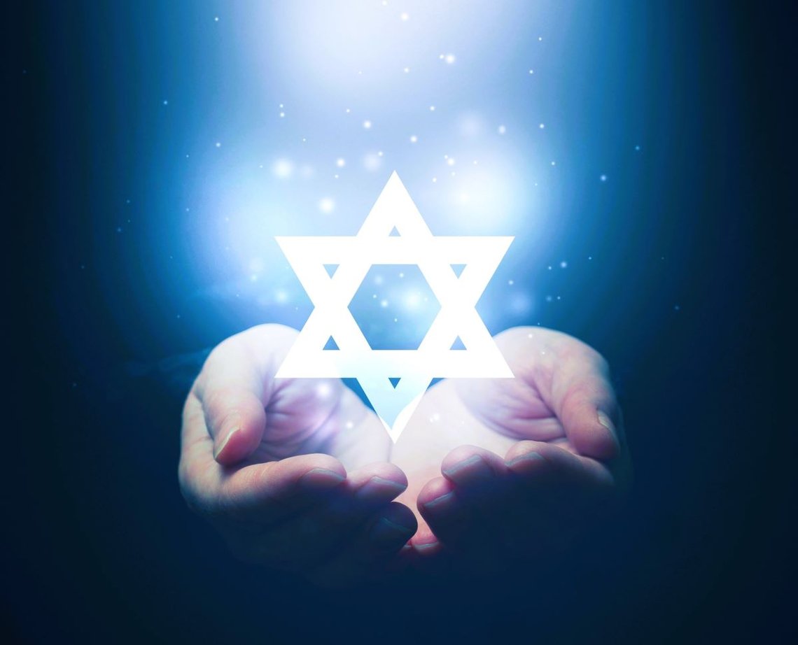 Female hands opening to light and David's star. Photo: Shutterstock by Bits And Splits, Serbia. Female hands opening to light and David's star. Photo: Shutterstock by Bits And Splits, Serbia.