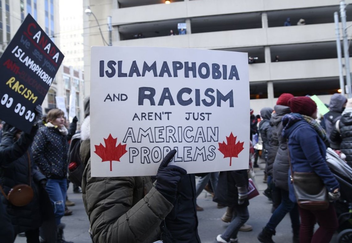 TORONTO-FEBRUARY 4:People with posters rejecting racism & Islamophobia during a protest in front of the US Consulate to denounce Trump's immigration policies on February 4,2017 in Toronto, Canada. Photo: Shutterstock by arindambanerjee. TORONTO-FEBRUARY 4:People with posters rejecting racism & Islamophobia during a protest in front of the US Consulate to denounce Trump's immigration policies on February 4,2017 in Toronto, Canada. Photo: Shutterstock by arindambanerjee.
