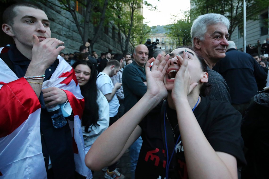 A protester shouts outside the parliament building in Tbilisi, Georgia, on Tuesday, April 16, 2024, to protest against "the Russian law" similar to a law that Russia uses to stigmatize independent news media and organizations seen as being at odds with the Kremlin. (AP Photo/Zurab Tsertsvadze) A protester shouts outside the parliament building in Tbilisi, Georgia, on Tuesday, April 16, 2024, to protest against "the Russian law" similar to a law that Russia uses to stigmatize independent news media and organizations seen as being at odds with the Kremlin. (AP Photo/Zurab Tsertsvadze)