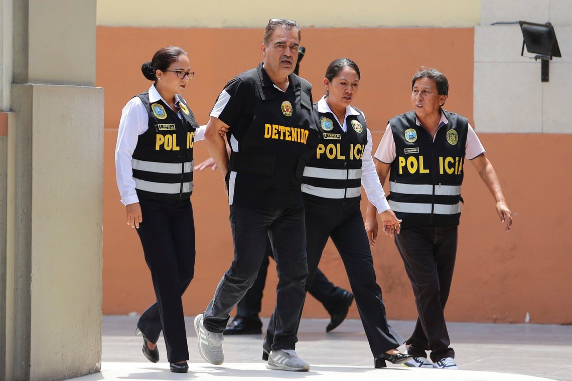 Officers escort Iranian Majid Azizi at police headquarters in Lima, Peru, Friday, March 8, 2024. (AP Photo/Manuel Castillo) Officers escort Iranian Majid Azizi at police headquarters in Lima, Peru, Friday, March 8, 2024. (AP Photo/Manuel Castillo)