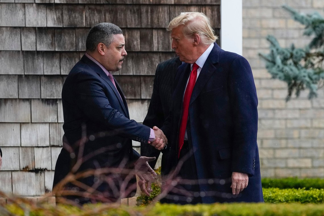 New York City Police Commissioner Edward A. Caban, left, shakes hands with Former President Donald Trump as he arrives for the wake of New York City police officer Jonathan Diller, Thursday, March 28, 2024, in Massapequa Park, N.Y. Diller was shot and killed Monday during a traffic stop, the city's mayor said. It marked the first slaying of an NYPD officer in two years. (AP Photo/Frank Franklin II) New York City Police Commissioner Edward A. Caban, left, shakes hands with Former President Donald Trump as he arrives for the wake of New York City police officer Jonathan Diller, Thursday, March 28, 2024, in Massapequa Park, N.Y. Diller was shot and killed Monday during a traffic stop, the city's mayor said. It marked the first slaying of an NYPD officer in two years. (AP Photo/Frank Franklin II)