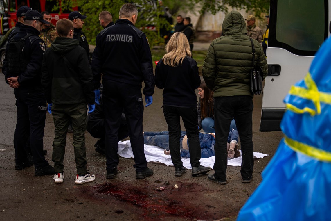 Forensic and police team members work near the body of a killed woman after a Russian bombardment in Chernihiv, Ukraine, Wednesday, April 17, 2024. Three Russian missiles slammed into a downtown area of the northern Ukrainian city of Chernihiv on Wednesday, hitting an eight-floor apartment building and killing at least 14 people, authorities said. (AP Photo/Francisco Seco) Forensic and police team members work near the body of a killed woman after a Russian bombardment in Chernihiv, Ukraine, Wednesday, April 17, 2024. Three Russian missiles slammed into a downtown area of the northern Ukrainian city of Chernihiv on Wednesday, hitting an eight-floor apartment building and killing at least 14 people, authorities said. (AP Photo/Francisco Seco)