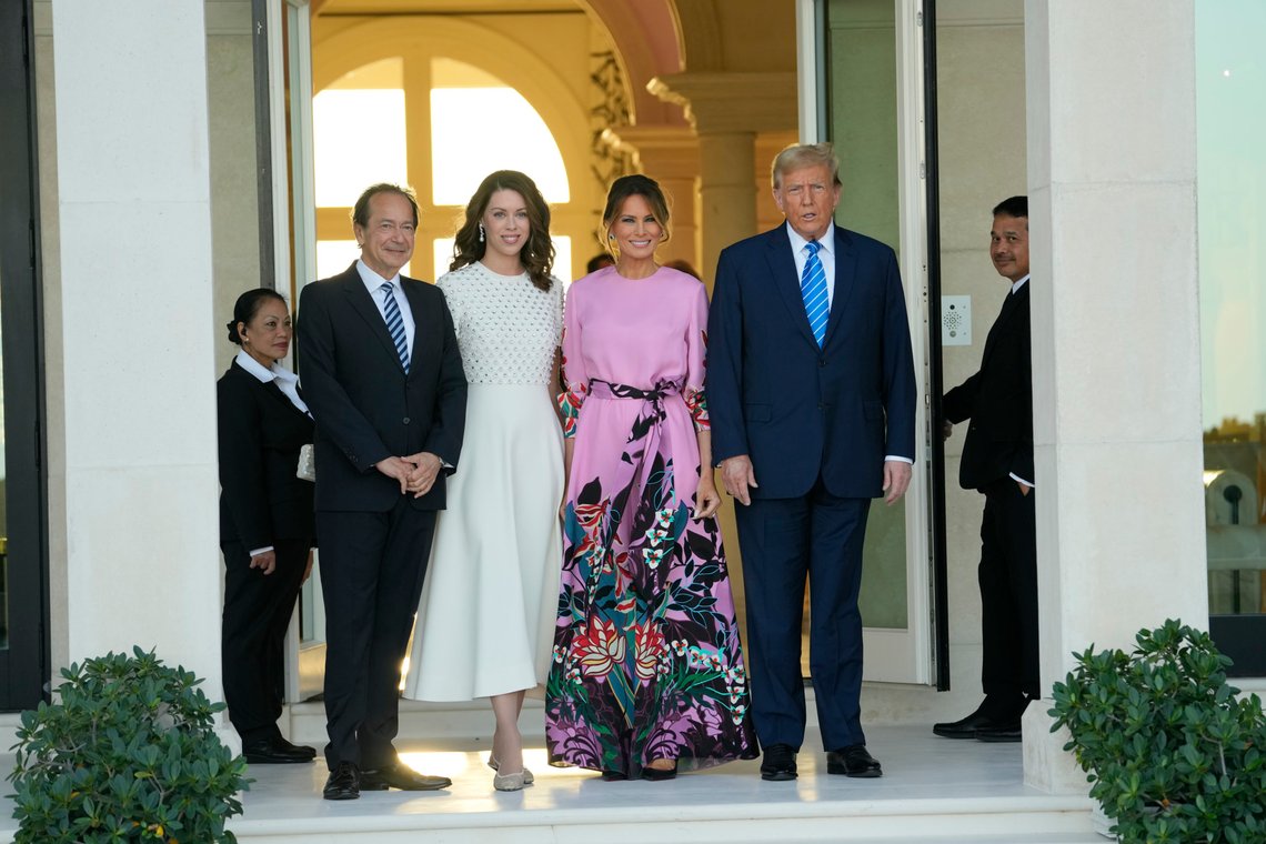 Former President Donald Trump, right, stands with Melania Trump, second from right, as they are greeted by John Paulson, left, and Alina de Almeida, second from left, at a GOP fundraiser, Saturday, April 6, 2024, in Palm Beach, Fla. (AP Photo/Lynne Sladky) Former President Donald Trump, right, stands with Melania Trump, second from right, as they are greeted by John Paulson, left, and Alina de Almeida, second from left, at a GOP fundraiser, Saturday, April 6, 2024, in Palm Beach, Fla. (AP Photo/Lynne Sladky)