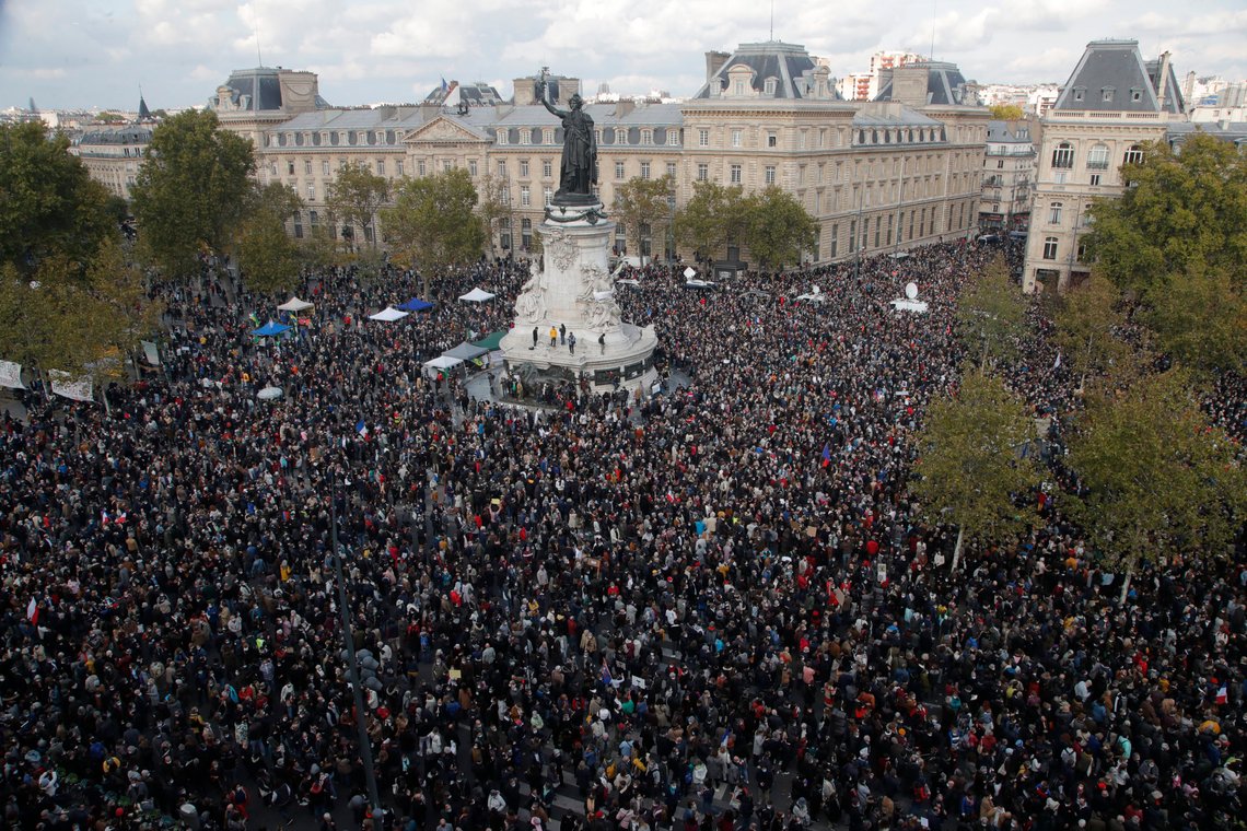 FILE - Hundreds of people gather on Republique square during a demonstration Sunday Oct. 18, 2020 in Paris in support of freedom of speech and to pay tribute to a French history teacher who was beheaded near Paris after discussing caricatures of Islam's Prophet Muhammad with his class. A French juvenile court is handing down a verdict Friday Dec.8, 2023 for six teenagers accused of involvement in the killing of teacher Samuel Paty, beheaded by an Islamic extremist after he showed caricatures of the Prophet Muhammad to his class for a debate on freedom of expression. (AP Photo/Michel Euler, File) FILE - Hundreds of people gather on Republique square during a demonstration Sunday Oct. 18, 2020 in Paris in support of freedom of speech and to pay tribute to a French history teacher who was beheaded near Paris after discussing caricatures of Islam's Prophet Muhammad with his class. A French juvenile court is handing down a verdict Friday Dec.8, 2023 for six teenagers accused of involvement in the killing of teacher Samuel Paty, beheaded by an Islamic extremist after he showed caricatures of the Prophet Muhammad to his class for a debate on freedom of expression. (AP Photo/Michel Euler, File)