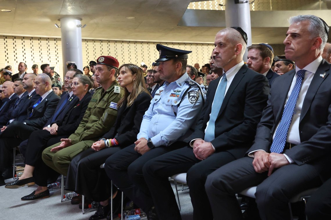 From right, Mossad intelligence agency chief David Barnea and the Chief of Israel's domestic Shin Bet security agency Ronen Bar attend a ceremony marking Memorial Day for fallen soldiers of Israel's wars and victims of attacks at Jerusalem's Mount Herzl military cemetery Monday, May 13, 2024. (Gil Cohen-Magen/Pool Photo via AP) From right, Mossad intelligence agency chief David Barnea and the Chief of Israel's domestic Shin Bet security agency Ronen Bar attend a ceremony marking Memorial Day for fallen soldiers of Israel's wars and victims of attacks at Jerusalem's Mount Herzl military cemetery Monday, May 13, 2024. (Gil Cohen-Magen/Pool Photo via AP)
