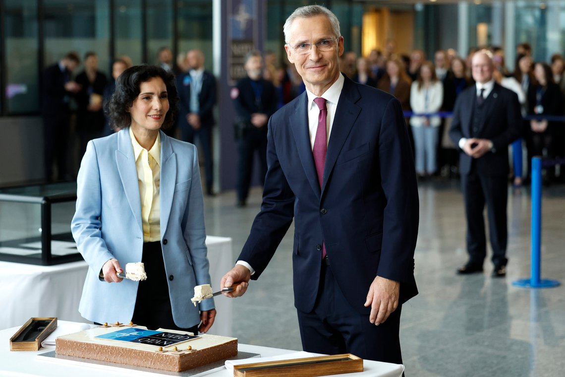 NATO Secretary General Jens Stoltenberg, right, and Belgium's Foreign Minister Hadja Lahbib cut a cake during a ceremony to mark the 75th anniversary of NATO at NATO headquarters in Brussels, Thursday, April 4, 2024. NATO marked on Thursday 75 years of collective defense across Europe and North America, with its top diplomats vowing to stay the course in Ukraine as better armed Russian troops assert control on the battlefield. (AP Photo/Geert Vanden Wijngaert) NATO Secretary General Jens Stoltenberg, right, and Belgium's Foreign Minister Hadja Lahbib cut a cake during a ceremony to mark the 75th anniversary of NATO at NATO headquarters in Brussels, Thursday, April 4, 2024. NATO marked on Thursday 75 years of collective defense across Europe and North America, with its top diplomats vowing to stay the course in Ukraine as better armed Russian troops assert control on the battlefield. (AP Photo/Geert Vanden Wijngaert)