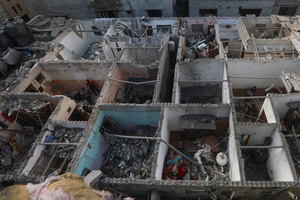 Palestinians look at the destruction after an Israeli strike on residential building in Rafah, Gaza Strip, Tuesday, May 7, 2024. (AP Photo/Ismael Abu Dayyah) Palestinians look at the destruction after an Israeli strike on residential building in Rafah, Gaza Strip, Tuesday, May 7, 2024. (AP Photo/Ismael Abu Dayyah)