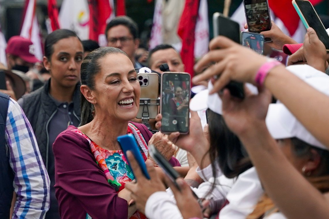 FILE - Presidential candidate Claudia Sheinbaum greets supporters during her opening campaign rally at the Zocalo in Mexico City, March 1, 2024. Masked men stopped a vehicle carrying Sheinbaum, Mexico’s leading presidential candidate, while she was traveling between campaign stops Sunday, April 21, to ask that she address the violence in the southern state of Chiapas if she wins the June 2 election. (AP Photo/Aurea Del Rosario, File) FILE - Presidential candidate Claudia Sheinbaum greets supporters during her opening campaign rally at the Zocalo in Mexico City, March 1, 2024. Masked men stopped a vehicle carrying Sheinbaum, Mexico’s leading presidential candidate, while she was traveling between campaign stops Sunday, April 21, to ask that she address the violence in the southern state of Chiapas if she wins the June 2 election. (AP Photo/Aurea Del Rosario, File)
