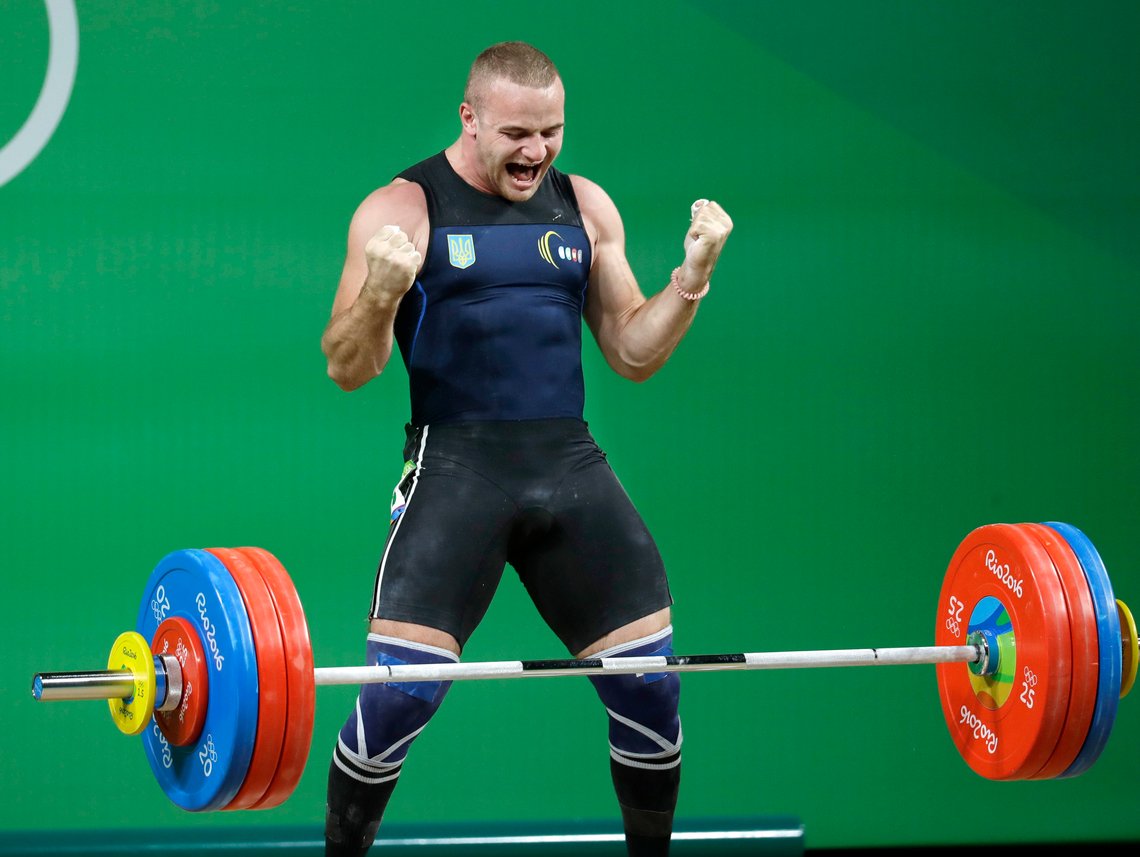 FILE - Oleksandr Pielieshenko, of Ukraine, celebrates after a lift in the men's 85kg weightlifting competition at the 2016 Summer Olympics in Rio de Janeiro, Brazil, on Aug. 12, 2016. The Ukrainian Olympic Committee says two-time European weightlifting champion Oleksandr Pielieshenko has died on the front line in the war in Ukraine. (AP Photo/Mike Groll, File) FILE - Oleksandr Pielieshenko, of Ukraine, celebrates after a lift in the men's 85kg weightlifting competition at the 2016 Summer Olympics in Rio de Janeiro, Brazil, on Aug. 12, 2016. The Ukrainian Olympic Committee says two-time European weightlifting champion Oleksandr Pielieshenko has died on the front line in the war in Ukraine. (AP Photo/Mike Groll, File)