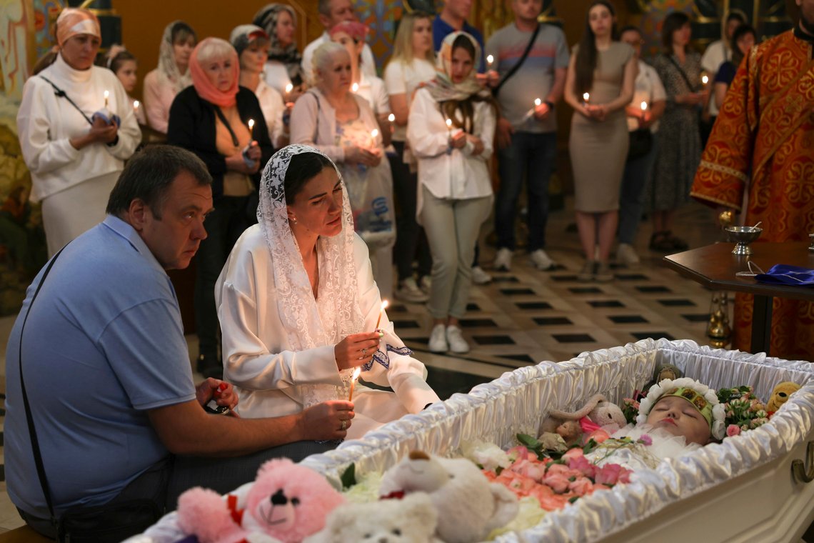 Parents of 4-year-old Zlata Rostochil mourn at their daughter's coffin at the Cathedral of the Transfiguration of the Savior in Odesa, Ukraine, Sunday, May 26. The girl was severely injured among dozens other civilians when Russian ballistic missiles hit the coastal area in Odesa on April 29, 2024. (AP Photo/Victor Sajenko) Parents of 4-year-old Zlata Rostochil mourn at their daughter's coffin at the Cathedral of the Transfiguration of the Savior in Odesa, Ukraine, Sunday, May 26. The girl was severely injured among dozens other civilians when Russian ballistic missiles hit the coastal area in Odesa on April 29, 2024. (AP Photo/Victor Sajenko)