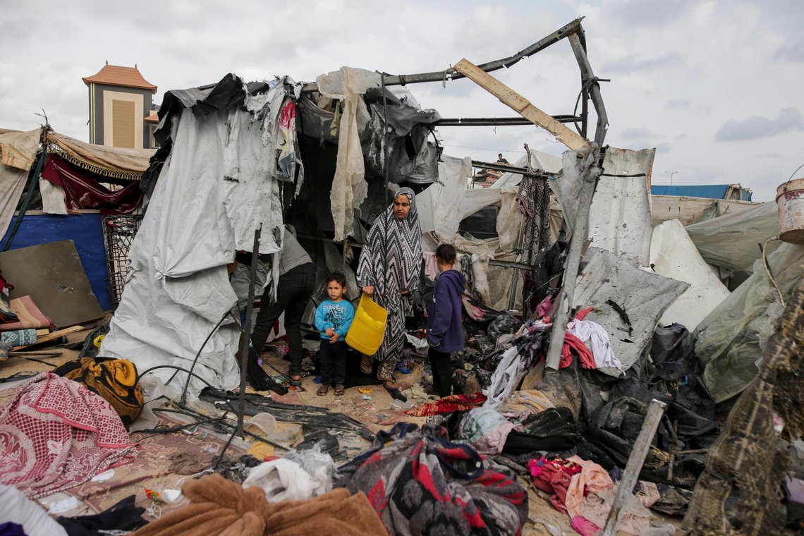 Displaced Palestinians inspect their tents destroyed by Israel's bombardment, adjunct to an UNRWA facility west of Rafah city, Gaza Strip, Tuesday, May 28, 2024. (AP Photo/Jehad Alshrafi) Displaced Palestinians inspect their tents destroyed by Israel's bombardment, adjunct to an UNRWA facility west of Rafah city, Gaza Strip, Tuesday, May 28, 2024. (AP Photo/Jehad Alshrafi)