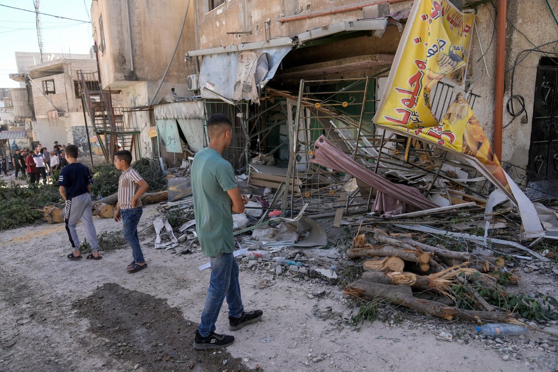 Palestinians inspect the damage in Al Fara'a refugee camp in the occupied West Bank following an Israeli military raid, Monday, June 10, 2024. Israel's military killed a 15-year-old Palestinian in an overnight raid on Al Fara'a refugee camp in the occupied West Bank, according to Palestinian health officials. The military said Monday that it had begun what it described as a "counterterrorism" raid into the camp. It said soldiers killed one militant and injured two more with live fire and said the heavy exchanges of gunfire were ongoing. (AP Photo/Majdi Mohammed) Palestinians inspect the damage in Al Fara'a refugee camp in the occupied West Bank following an Israeli military raid, Monday, June 10, 2024. Israel's military killed a 15-year-old Palestinian in an overnight raid on Al Fara'a refugee camp in the occupied West Bank, according to Palestinian health officials. The military said Monday that it had begun what it described as a "counterterrorism" raid into the camp. It said soldiers killed one militant and injured two more with live fire and said the heavy exchanges of gunfire were ongoing. (AP Photo/Majdi Mohammed)