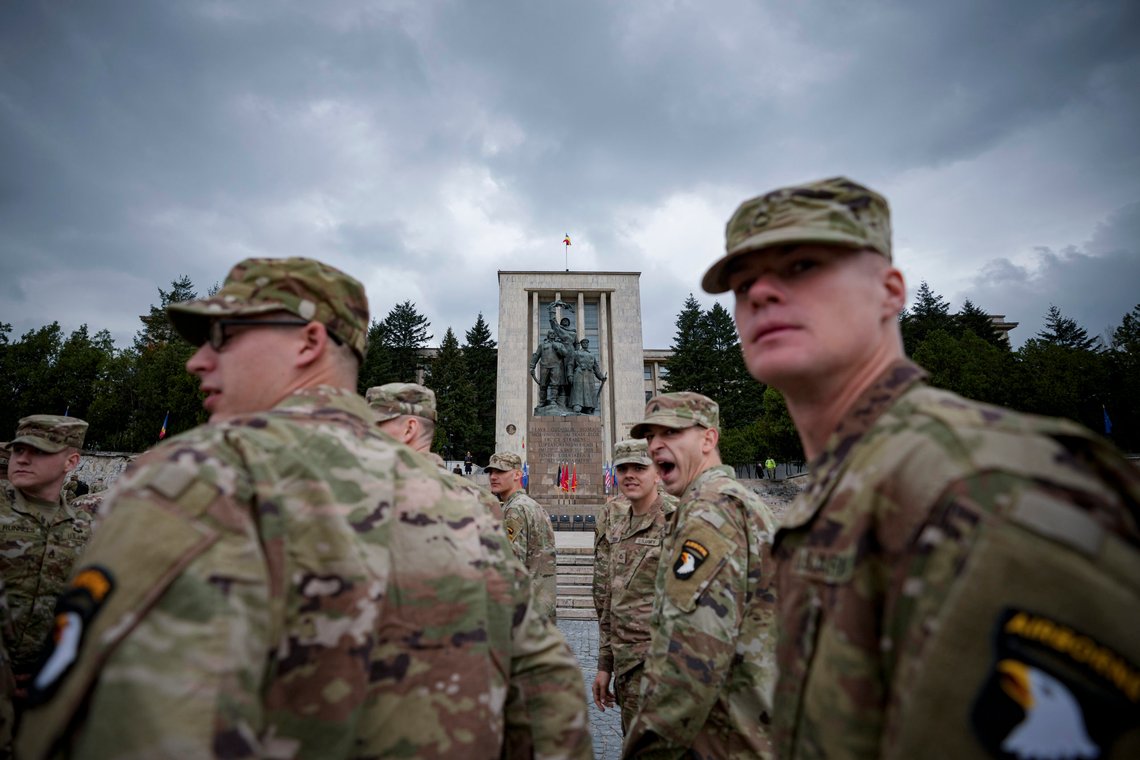 U.S. military personnel arrive for a transfer of authority ceremony from the 101st Airborne Division to the 10th Mountain Division in Bucharest, Romania, Wednesday, April 5, 2023. U.S. troops are deployed to Romania along with forces from other NATO member states as the alliance looks to boost security on its southeastern flank amid Russia's war in Ukraine. (AP Photo/Andreea Alexandru) U.S. military personnel arrive for a transfer of authority ceremony from the 101st Airborne Division to the 10th Mountain Division in Bucharest, Romania, Wednesday, April 5, 2023. U.S. troops are deployed to Romania along with forces from other NATO member states as the alliance looks to boost security on its southeastern flank amid Russia's war in Ukraine. (AP Photo/Andreea Alexandru)