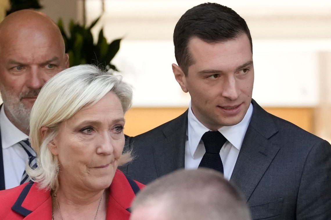 Far-right National Rally party president Jordan Bardella, right, leaves with far-right leader Marine Le Pen after a press conference, Monday, June 24, 2024 in Paris. The upcoming two-round parliamentary election will take place on June 30 and July 7. (AP Photo/Christophe Ena) Far-right National Rally party president Jordan Bardella, right, leaves with far-right leader Marine Le Pen after a press conference, Monday, June 24, 2024 in Paris. The upcoming two-round parliamentary election will take place on June 30 and July 7. (AP Photo/Christophe Ena)