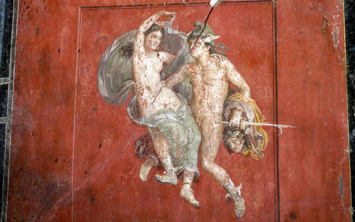 A detail of a fresco showing Perseus and Andromeda surrounded in a Pompeii red, that decorates the living room of house of the Vetti, in one of the wealthiest homes in Pompeii, the House of the Vetti, in the Pompeii archeological site, Thursday, Dec. 7, 2023. A new project in Pompeii is combining traditional dyeing techniques with colorful frescoes, a historic reconstruction of a garden with Roman-era plants and the study of a steamy workshop where slaves dyed cloth, to revive the daily life in the ancient city before the eruption. (AP Photo/Andrew Medichini) A detail of a fresco showing Perseus and Andromeda surrounded in a Pompeii red, that decorates the living room of house of the Vetti, in one of the wealthiest homes in Pompeii, the House of the Vetti, in the Pompeii archeological site, Thursday, Dec. 7, 2023. A new project in Pompeii is combining traditional dyeing techniques with colorful frescoes, a historic reconstruction of a garden with Roman-era plants and the study of a steamy workshop where slaves dyed cloth, to revive the daily life in the ancient city before the eruption. (AP Photo/Andrew Medichini)