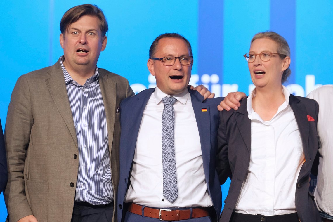 From left, Maximilian Krah, the 'Alternative fuer Deutschland' (Alternative for Germany) party top candidate for the European elections, Tino Chrupalla, co-chairman of the AfD and Alice Weidel, co-chairwoman of the AfD, sing the national anthem at the end of the European election meeting in Magdeburg, Germany, Sunday, Aug. 6, 2023. The 10-year-old Alternative for Germany, or AfD, gathered in the eastern city of Magdeburg for a convention stretching over two weekends at which it plans to choose candidates and set its policy platform for next June's European Parliament election. (Klaus-Dietmar Gabbert/dpa via AP) From left, Maximilian Krah, the 'Alternative fuer Deutschland' (Alternative for Germany) party top candidate for the European elections, Tino Chrupalla, co-chairman of the AfD and Alice Weidel, co-chairwoman of the AfD, sing the national anthem at the end of the European election meeting in Magdeburg, Germany, Sunday, Aug. 6, 2023. The 10-year-old Alternative for Germany, or AfD, gathered in the eastern city of Magdeburg for a convention stretching over two weekends at which it plans to choose candidates and set its policy platform for next June's European Parliament election. (Klaus-Dietmar Gabbert/dpa via AP)