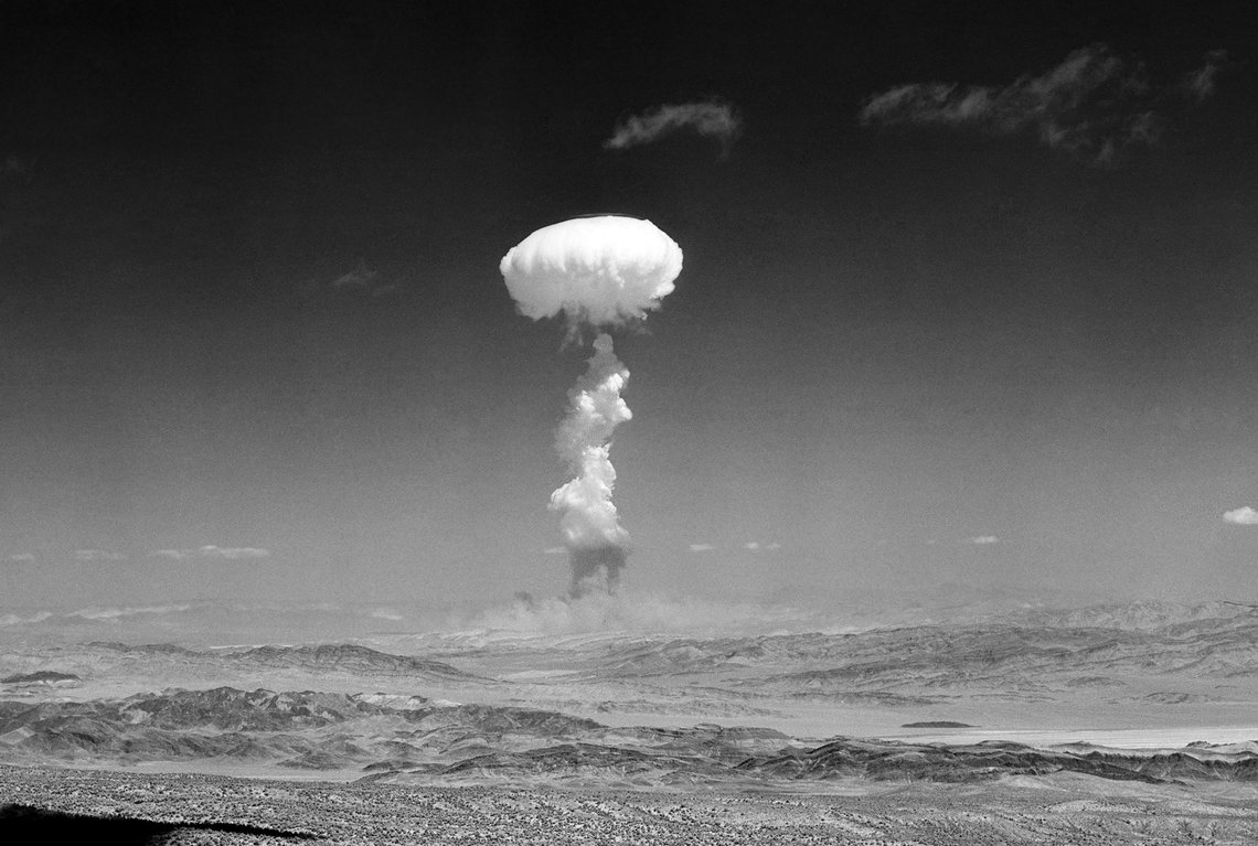 FILE - In this April 22, 1952, file photo, a gigantic pillar of smoke with the familiar mushroom top climbs above Yucca Flat, Nev. during nuclear test detonation. There were more than 1,000 atomic tests in Nevada's desert between 1951 and 1992, including about 100 above the ground. The blasts ushered in a new era of Nevada history that previously had been relegated to the perceived uncouth behavior of gambling, prostitution and easy divorces. (AP Photo/File) FILE - In this April 22, 1952, file photo, a gigantic pillar of smoke with the familiar mushroom top climbs above Yucca Flat, Nev. during nuclear test detonation. There were more than 1,000 atomic tests in Nevada's desert between 1951 and 1992, including about 100 above the ground. The blasts ushered in a new era of Nevada history that previously had been relegated to the perceived uncouth behavior of gambling, prostitution and easy divorces. (AP Photo/File)