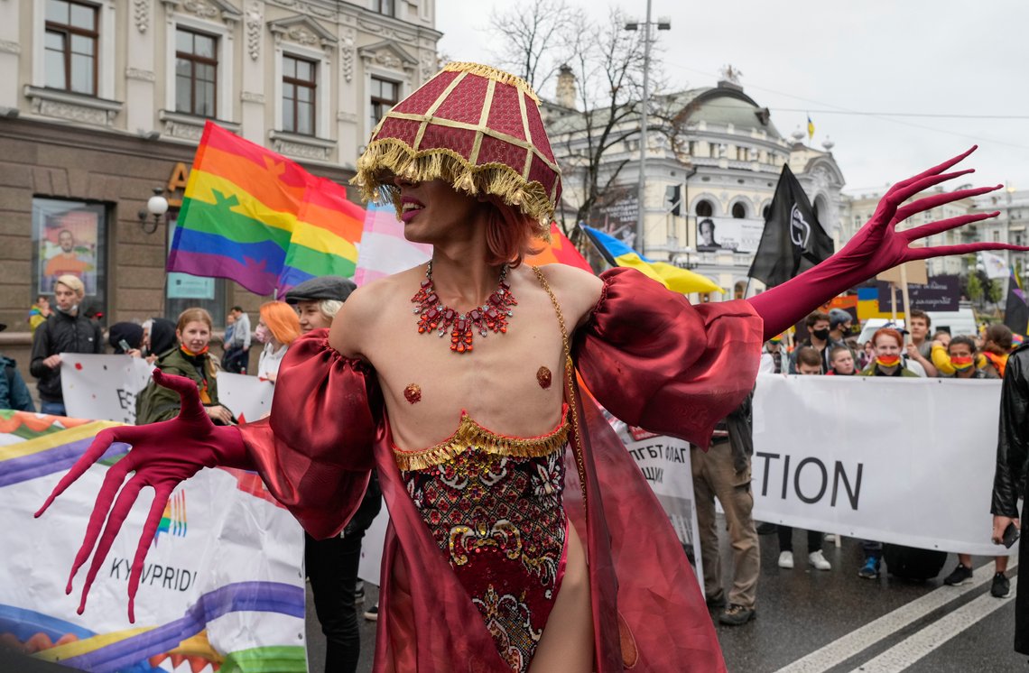 People take part in the annual Gay Pride parade, under the protection of riot police in Kyiv, Ukraine, Sunday, Sept. 19, 2021. Around five thousand LGBT activists and associations paraded in the center of Kyiv. (AP Photo/Efrem Lukatsky) People take part in the annual Gay Pride parade, under the protection of riot police in Kyiv, Ukraine, Sunday, Sept. 19, 2021. Around five thousand LGBT activists and associations paraded in the center of Kyiv. (AP Photo/Efrem Lukatsky)