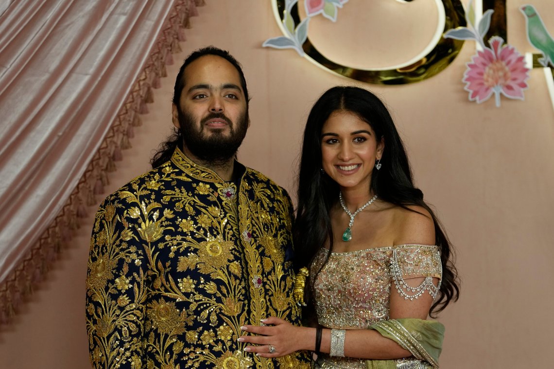 FILE - Anant Ambani, left, and Radhika Merchant pose for photographers during their pre-wedding ceremony in Mumbai, India, Friday, July 5, 2024. (AP Photo/Rajanish Kakade, File) FILE - Anant Ambani, left, and Radhika Merchant pose for photographers during their pre-wedding ceremony in Mumbai, India, Friday, July 5, 2024. (AP Photo/Rajanish Kakade, File)