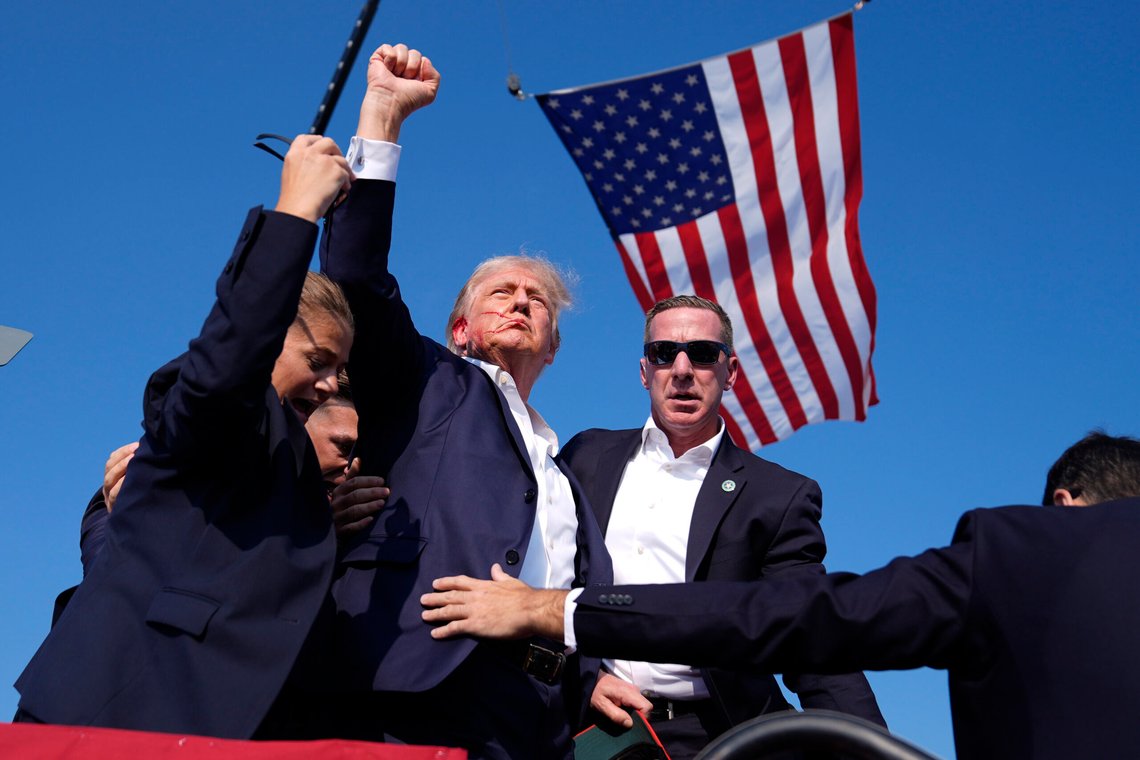 Republican presidential candidate former President Donald Trump is surrounded by U.S. Secret Service agents at a campaign rally, Saturday, July 13, 2024, in Butler, Pa. (AP Photo/Evan Vucci) Republican presidential candidate former President Donald Trump is surrounded by U.S. Secret Service agents at a campaign rally, Saturday, July 13, 2024, in Butler, Pa. (AP Photo/Evan Vucci)