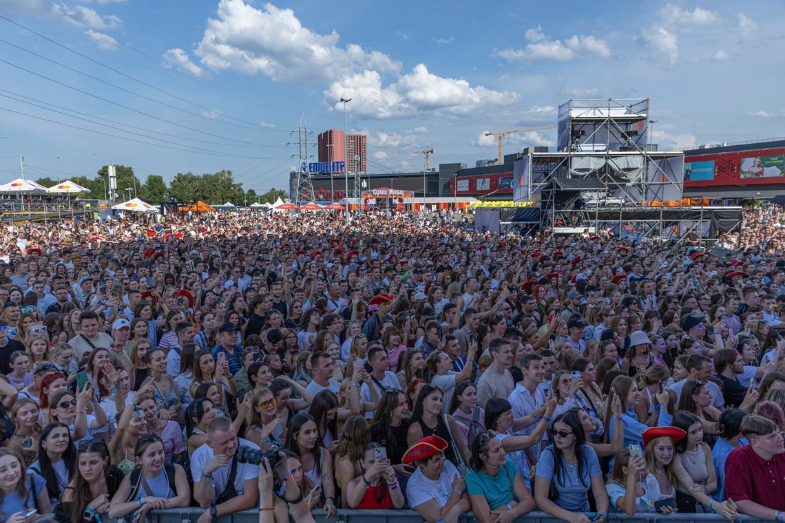 People enjoy a concert at the Atlas Festival in Kyiv, Ukraine, Sunday, July 21, 2024. This year, Ukraine's largest music festival struck a different chord. Gone were the international headliners, the massive performance halls and the hundreds of thousands of visitors. (AP Photo/Anton Shtuka) People enjoy a concert at the Atlas Festival in Kyiv, Ukraine, Sunday, July 21, 2024. This year, Ukraine's largest music festival struck a different chord. Gone were the international headliners, the massive performance halls and the hundreds of thousands of visitors. (AP Photo/Anton Shtuka)