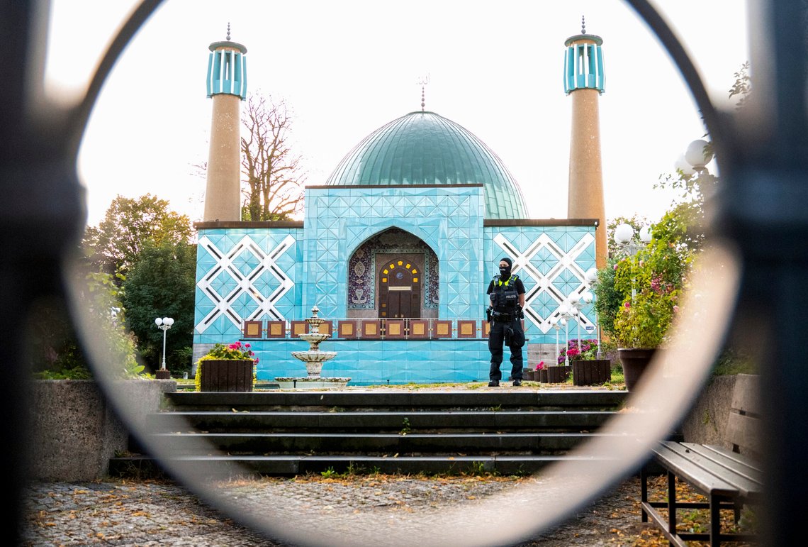 A police officer stands outside the Islamic Center Hamburg with the Imam Ali Mosque during a raid Wednesday, July 24, 2024, Hamburg, Germany. (Daniel Bockwoldt/dpa via AP) A police officer stands outside the Islamic Center Hamburg with the Imam Ali Mosque during a raid Wednesday, July 24, 2024, Hamburg, Germany. (Daniel Bockwoldt/dpa via AP)