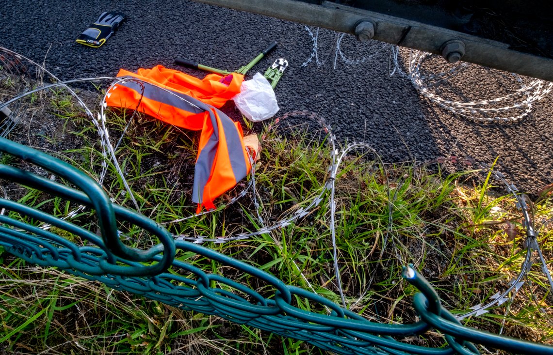 Climate activists left their equipment behind after cutting a hole in a fence near a runway at the airport in Frankfurt, Germany, Thursday, July 25, 2024. The activists glued themselves to the ground blocking air traffic for several hours. (AP Photo/Michael Probst) Climate activists left their equipment behind after cutting a hole in a fence near a runway at the airport in Frankfurt, Germany, Thursday, July 25, 2024. The activists glued themselves to the ground blocking air traffic for several hours. (AP Photo/Michael Probst)