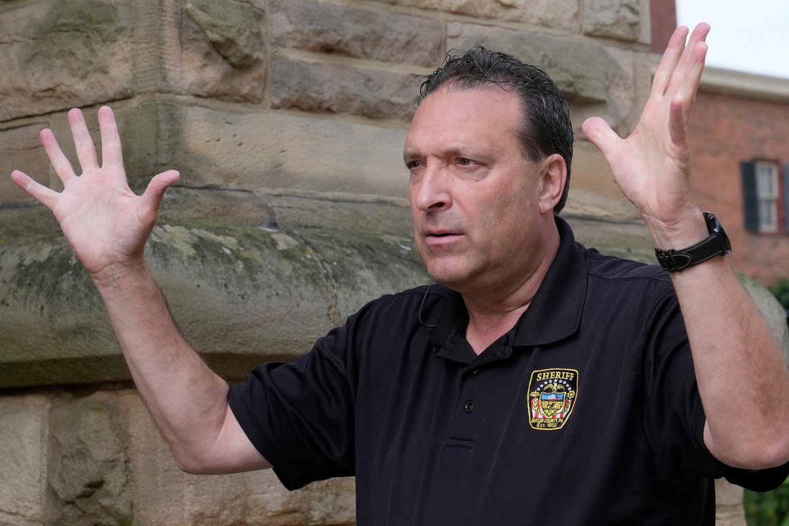 Butler County, Pa. Sheriff Michael Slupe is pictured during an interview in Butler, Pa., Monday, July 15, 2024. Slupe told The Associated Press that a local officer climbed to the roof and encountered Thomas Matthew Crooks, who saw the officer and turned toward him just before the officer dropped down to safety. (AP Photo/Sue Ogrocki) Butler County, Pa. Sheriff Michael Slupe is pictured during an interview in Butler, Pa., Monday, July 15, 2024. Slupe told The Associated Press that a local officer climbed to the roof and encountered Thomas Matthew Crooks, who saw the officer and turned toward him just before the officer dropped down to safety. (AP Photo/Sue Ogrocki)