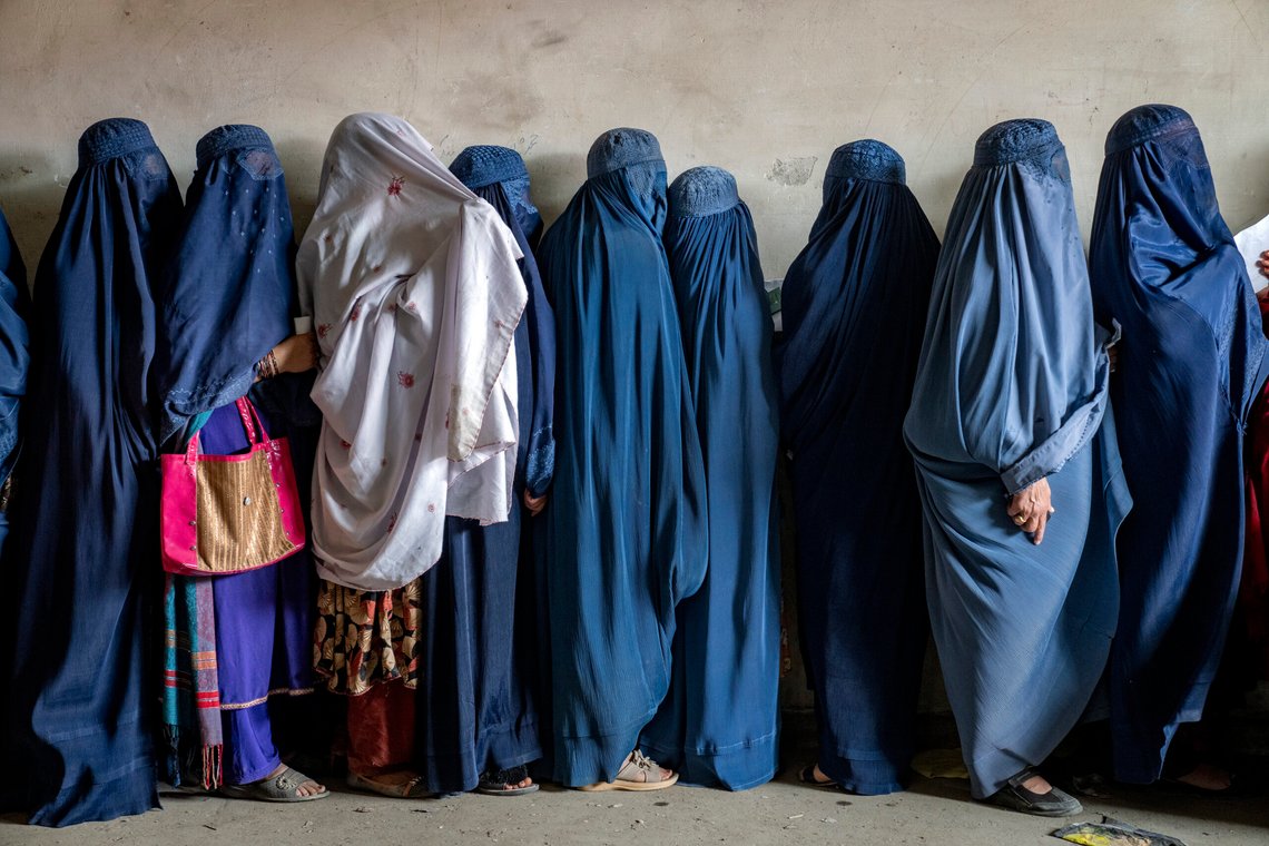 FILE - Afghan women wait to receive food rations distributed by a humanitarian aid group, in Kabul, Afghanistan, May 23, 2023. The Taliban Virtue and Vice Ministry had on May 7, 2022 ,said women in public must wear all-encompassing robes and cover their faces except for their eyes. (AP Photo/Ebrahim Noroozi, File) FILE - Afghan women wait to receive food rations distributed by a humanitarian aid group, in Kabul, Afghanistan, May 23, 2023. The Taliban Virtue and Vice Ministry had on May 7, 2022 ,said women in public must wear all-encompassing robes and cover their faces except for their eyes. (AP Photo/Ebrahim Noroozi, File)