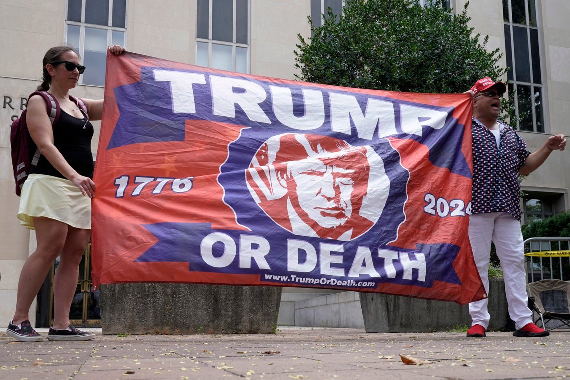 People protest at the E. Barrett Prettyman U.S. Federal Courthouse, Thursday, Aug. 3, 2023, in Washington. Former President Donald Trump is due in federal court in Washington today, to answer charges he sought to overturn his 2020 presidential election loss. (AP Photo/Mariam Zuhaib) People protest at the E. Barrett Prettyman U.S. Federal Courthouse, Thursday, Aug. 3, 2023, in Washington. Former President Donald Trump is due in federal court in Washington today, to answer charges he sought to overturn his 2020 presidential election loss. (AP Photo/Mariam Zuhaib)