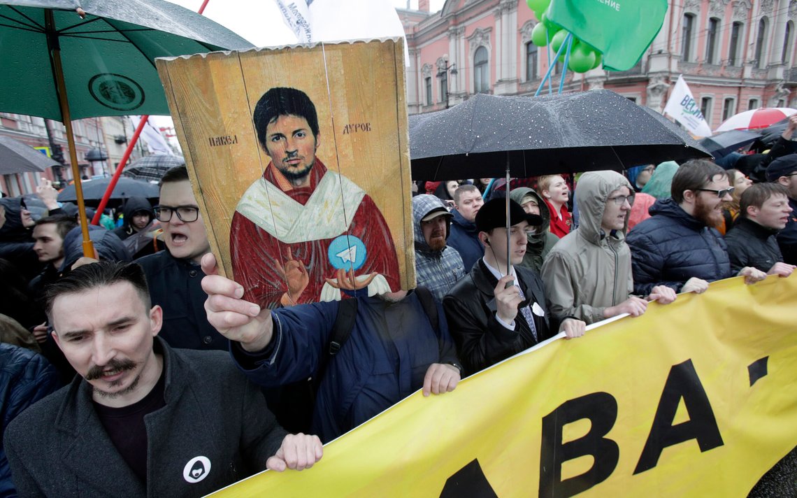 Protesters hold a portrait of messaging app Telegram co-founder Pavel Durov designed as an icon, protesting against the blocking of the app in Russia, during a May Day rally in St. Petersburg, Russia, Tuesday, May 1, 2018. In St. Petersburg, Russia's second-largest city, Russians unhappy with the Kremlin's attempts to curtail internet freedom joined the official May Day demonstration. Several hundred people braved the rainy weather and joined the column marching across St. Petersburg to protest the government's ban of popular messaging app Telegram. (AP Photo/Dmitri Lovetsky) Protesters hold a portrait of messaging app Telegram co-founder Pavel Durov designed as an icon, protesting against the blocking of the app in Russia, during a May Day rally in St. Petersburg, Russia, Tuesday, May 1, 2018. In St. Petersburg, Russia's second-largest city, Russians unhappy with the Kremlin's attempts to curtail internet freedom joined the official May Day demonstration. Several hundred people braved the rainy weather and joined the column marching across St. Petersburg to protest the government's ban of popular messaging app Telegram. (AP Photo/Dmitri Lovetsky)