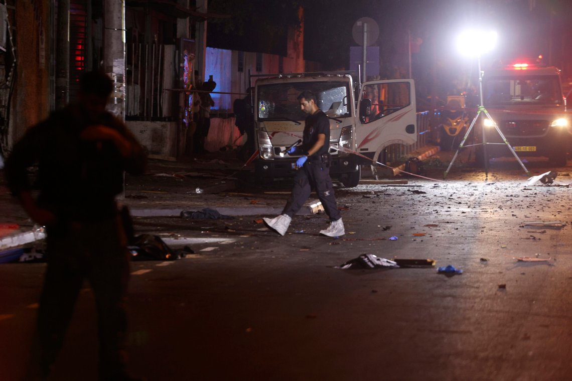 Israeli police work at the scene of a bomb explosion in Tel Aviv, Israel, Sunday, Aug. 18, 2024. Israeli Police say one person was killed and another moderately injured. (AP Photo/Moti Milrod) Israeli police work at the scene of a bomb explosion in Tel Aviv, Israel, Sunday, Aug. 18, 2024. Israeli Police say one person was killed and another moderately injured. (AP Photo/Moti Milrod)