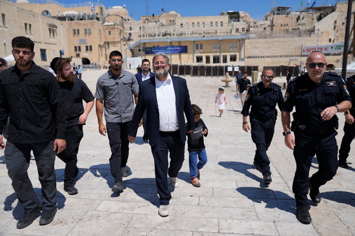 Israel's far-right National Security Minister Itamar Ben-Gvir, center, flanked by his security detail, approach the entrance to Jerusalem's most sensitive holy site, which Jews revere the site as the Temple Mount, believed to be the location of the First and Second Temples, and it is a holy site for Muslims as Haram al-Sharif or the Noble Sanctuary, in the Old City, Tuesday, Aug. 13, 2024. (AP Photo/Ohad Zwigenberg) Israel's far-right National Security Minister Itamar Ben-Gvir, center, flanked by his security detail, approach the entrance to Jerusalem's most sensitive holy site, which Jews revere the site as the Temple Mount, believed to be the location of the First and Second Temples, and it is a holy site for Muslims as Haram al-Sharif or the Noble Sanctuary, in the Old City, Tuesday, Aug. 13, 2024. (AP Photo/Ohad Zwigenberg)
