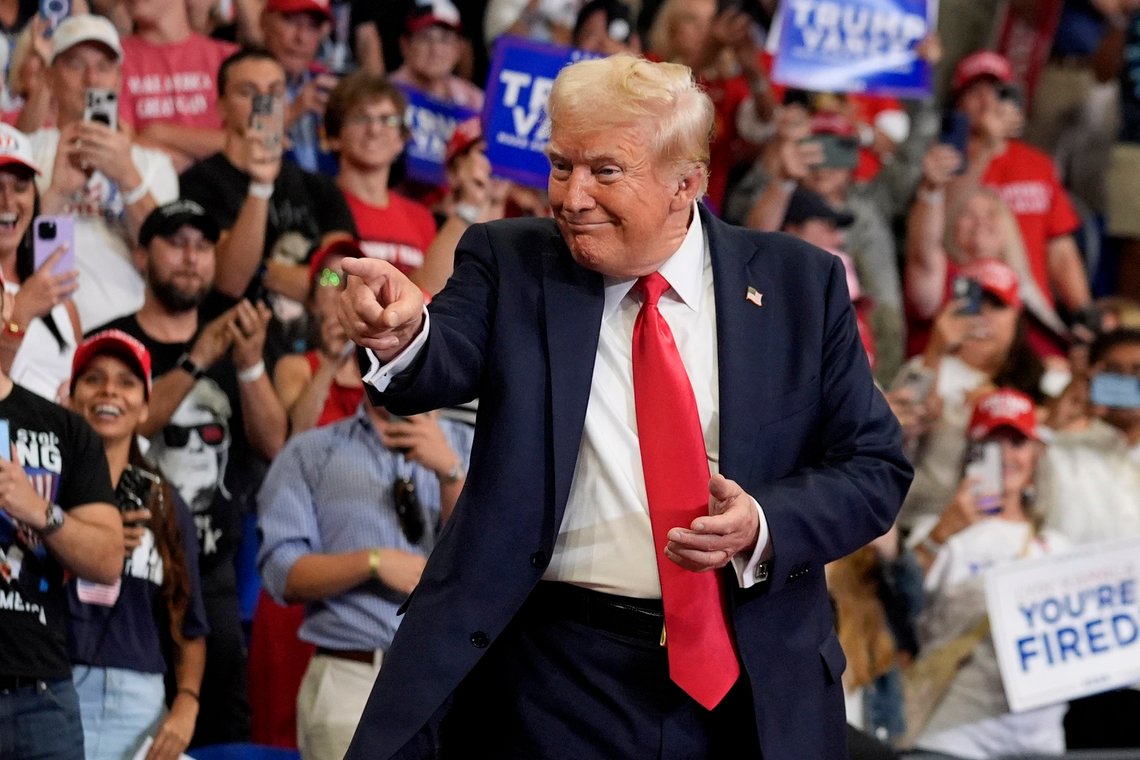 Republican presidential candidate former President Donald Trump gestures to the crowd as he arrives to speak at a campaign rally at Georgia State University in Atlanta, Saturday, Aug. 3, 2024. (AP Photo/John Bazemore) Republican presidential candidate former President Donald Trump gestures to the crowd as he arrives to speak at a campaign rally at Georgia State University in Atlanta, Saturday, Aug. 3, 2024. (AP Photo/John Bazemore)
