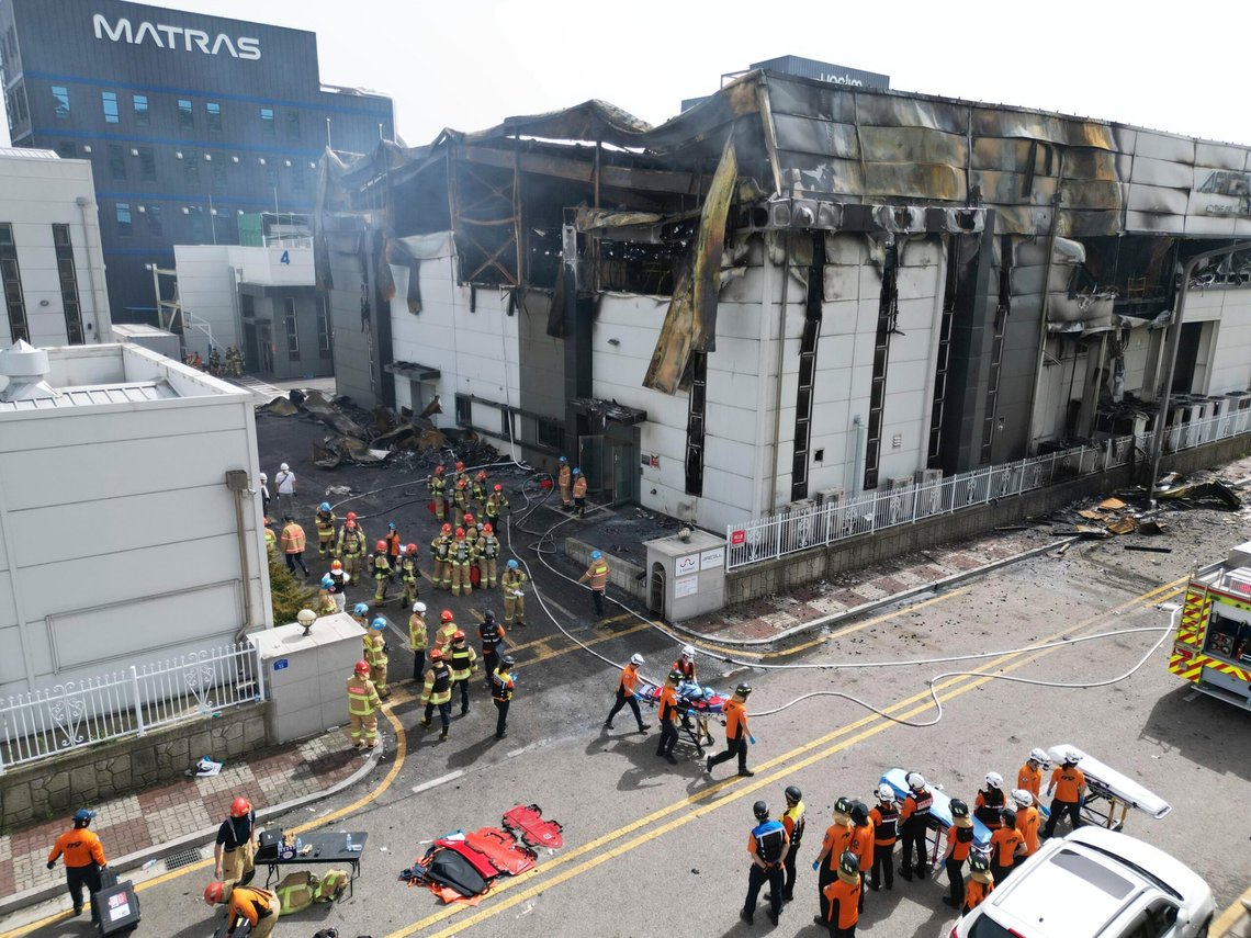 Firefighters carry a body at the site of a fire at a lithium battery manufacturing factory in Hwaseong, South Korea, Monday, June 24, 2024. (Newsis via AP) Firefighters carry a body at the site of a fire at a lithium battery manufacturing factory in Hwaseong, South Korea, Monday, June 24, 2024. (Newsis via AP)