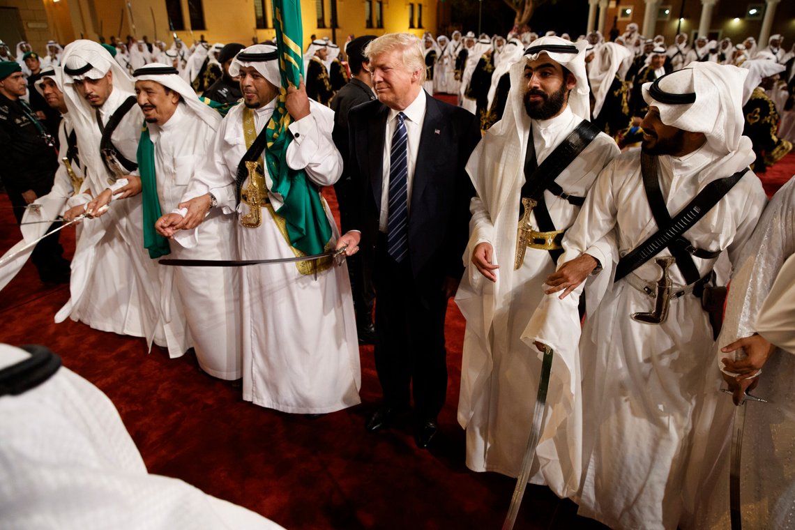FILE - In this Saturday, May 20, 2017 file photo, President Donald Trump holds a sword and sways with traditional dancers during a welcome ceremony at Murabba Palace, in Riyadh. Trump and his entourage were treated to a traditional all-male Saudi sword dance. Standing shoulder-to-shoulder with the Saudi king, Trump swayed side to side and briefly joined the groove. (AP Photo/Evan Vucci, File) FILE - In this Saturday, May 20, 2017 file photo, President Donald Trump holds a sword and sways with traditional dancers during a welcome ceremony at Murabba Palace, in Riyadh. Trump and his entourage were treated to a traditional all-male Saudi sword dance. Standing shoulder-to-shoulder with the Saudi king, Trump swayed side to side and briefly joined the groove. (AP Photo/Evan Vucci, File)