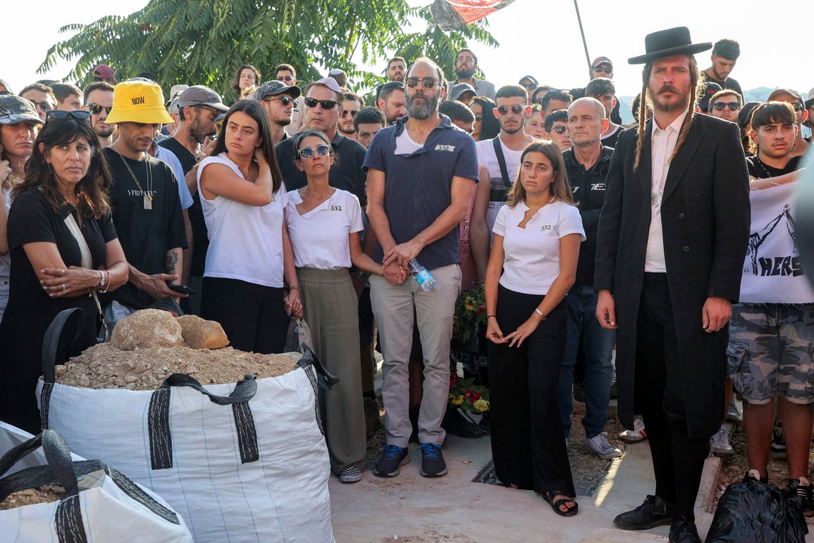 Jonathan Polin, center right, and Rachel Goldberg, center left, parents of Israeli-American hostage Hersh Goldberg-Polin, who was killed in Hamas captivity in the Gaza Strip, attend their son's funeral with their daughters Orly and Leebie, in Jerusalem, Monday, Sept. 2, 2024. (Gil Cohen-Magen/Pool via AP) Jonathan Polin, center right, and Rachel Goldberg, center left, parents of Israeli-American hostage Hersh Goldberg-Polin, who was killed in Hamas captivity in the Gaza Strip, attend their son's funeral with their daughters Orly and Leebie, in Jerusalem, Monday, Sept. 2, 2024. (Gil Cohen-Magen/Pool via AP)