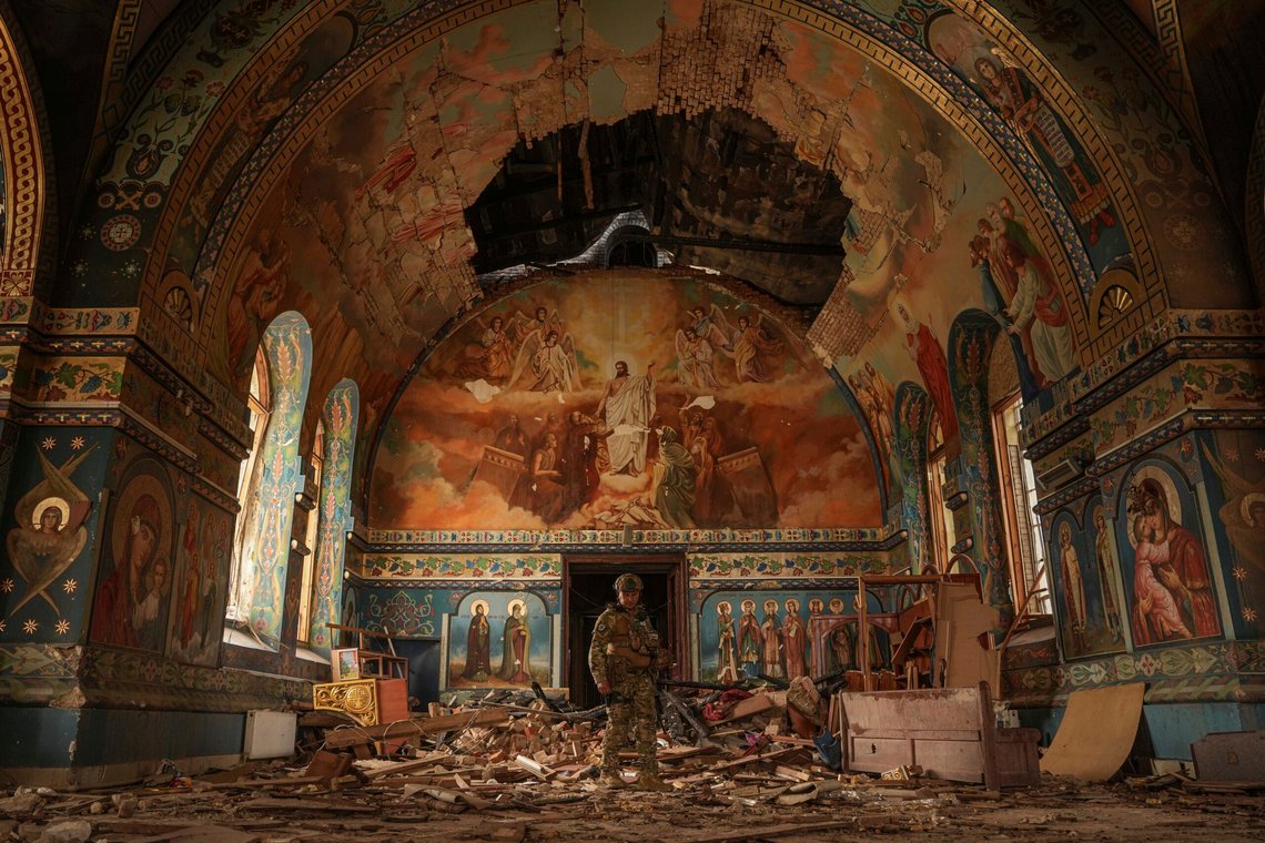 Ukrainian serviceman Gennadiy Yudin stands inside orthodox church heavily damaged by a Russian bombing in Novoekonomichne, Ukraine, Tuesday, Sept. 17, 2024. (AP Photo/Evgeniy Maloletka) Ukrainian serviceman Gennadiy Yudin stands inside orthodox church heavily damaged by a Russian bombing in Novoekonomichne, Ukraine, Tuesday, Sept. 17, 2024. (AP Photo/Evgeniy Maloletka)