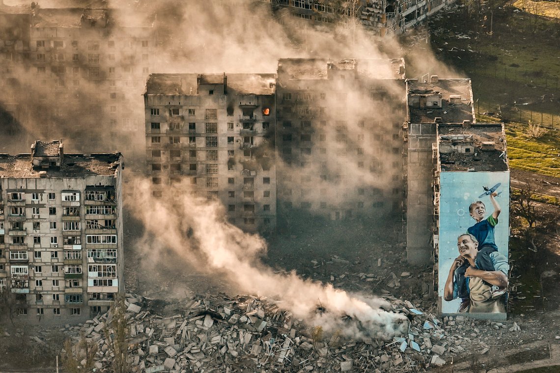 FILE - Smoke rises from a building in Bakhmut, site of the heaviest battles with the Russian troops in the Donetsk region, Ukraine, April 26, 2023. The GOP has been softening its stance on Russia ever since Donald Trump won the 2016 presidential election following Russian hacking of his Democratic opponents. The reasons include Russian President Vladimir Putin holding himself out as an international champion of conservative Christian values, the GOP's growing skepticism of international entanglements and Trump's own personal embrace of the Russian leader. Now the GOP's ambivalence on Russia has stalled additional aid to Ukraine. (AP Photo/Libkos, File) FILE - Smoke rises from a building in Bakhmut, site of the heaviest battles with the Russian troops in the Donetsk region, Ukraine, April 26, 2023. The GOP has been softening its stance on Russia ever since Donald Trump won the 2016 presidential election following Russian hacking of his Democratic opponents. The reasons include Russian President Vladimir Putin holding himself out as an international champion of conservative Christian values, the GOP's growing skepticism of international entanglements and Trump's own personal embrace of the Russian leader. Now the GOP's ambivalence on Russia has stalled additional aid to Ukraine. (AP Photo/Libkos, File)