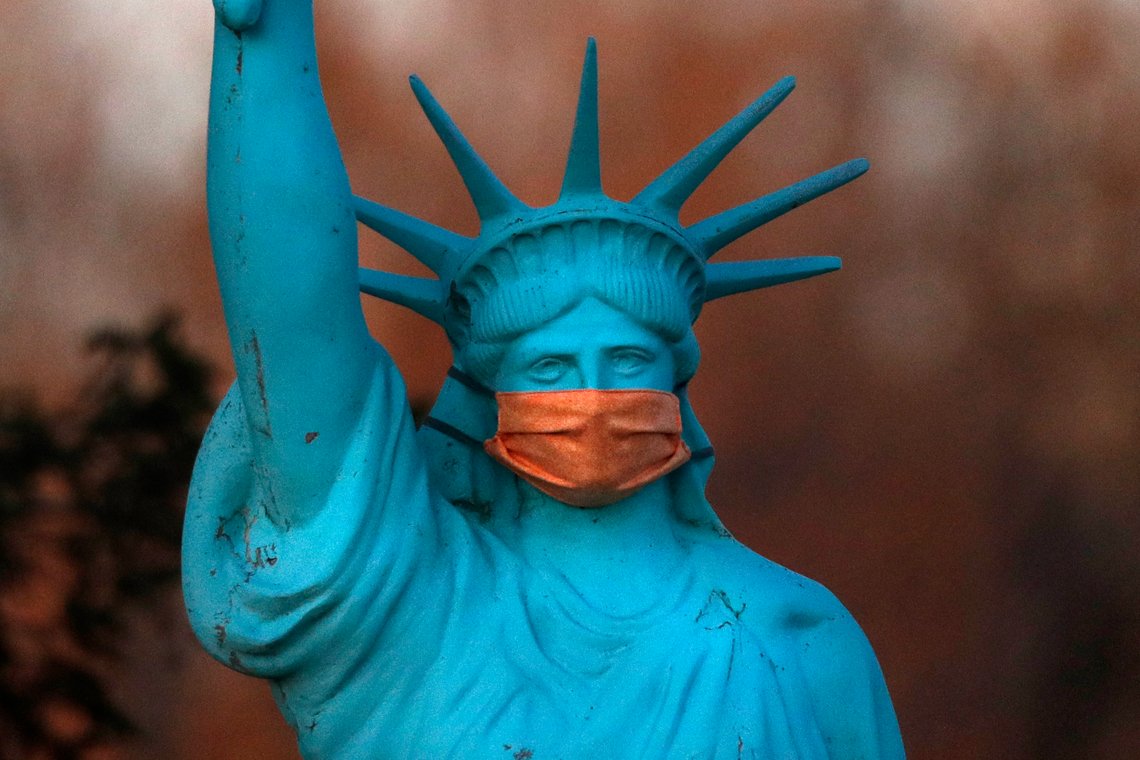 A replica of the Statue of Liberty wears a coronavirus mask outside a home on Deer Isle, Maine, Wednesday, May 6, 2020. (AP Photo/Robert F. Bukaty) A replica of the Statue of Liberty wears a coronavirus mask outside a home on Deer Isle, Maine, Wednesday, May 6, 2020. (AP Photo/Robert F. Bukaty)