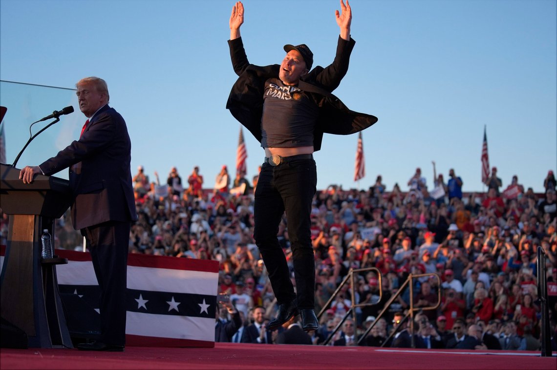 Elon Musk jumps on the stage as Republican presidential nominee former President Donald Trump speaks at a campaign rally at the Butler Farm Show, Saturday, Oct. 5, 2024, in Butler, Pa. (AP Photo/Evan Vucci) Elon Musk jumps on the stage as Republican presidential nominee former President Donald Trump speaks at a campaign rally at the Butler Farm Show, Saturday, Oct. 5, 2024, in Butler, Pa. (AP Photo/Evan Vucci)