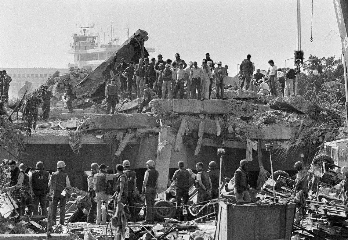 FILE - In this Oct. 24,1983 file photo, rescuers continue to probe the wreckage of the U.S. Marine barracks a day after a suicide truck bomb near Beirut airport, Lebanon. It was a century ago on Sept. 1, 1920, that a French general, Henri Gouraud, stood on the porch of the French residence in Beirut surrounded by local politicians and religious leaders and declared the State of Greater Lebanon - the precursor to the modern state of Lebanon. (AP Photo/Zouki, File) FILE - In this Oct. 24,1983 file photo, rescuers continue to probe the wreckage of the U.S. Marine barracks a day after a suicide truck bomb near Beirut airport, Lebanon. It was a century ago on Sept. 1, 1920, that a French general, Henri Gouraud, stood on the porch of the French residence in Beirut surrounded by local politicians and religious leaders and declared the State of Greater Lebanon - the precursor to the modern state of Lebanon. (AP Photo/Zouki, File)