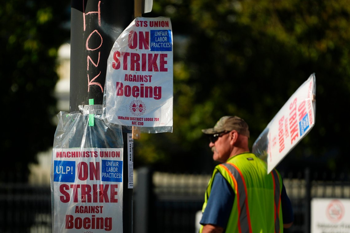 Signs are taped to a light pole as Boeing workers strike Tuesday, Sept. 24, 2024, outside the company's factory in Renton, Wash. (AP Photo/Lindsey Wasson) Signs are taped to a light pole as Boeing workers strike Tuesday, Sept. 24, 2024, outside the company's factory in Renton, Wash. (AP Photo/Lindsey Wasson)