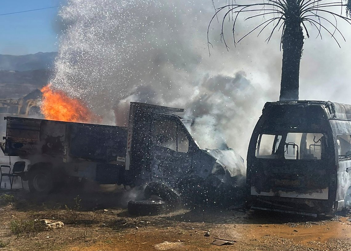 A truck and ambulance burn after Israeli airstrikes hit a group of paramedics outside a hospital in Marjayoun, south Lebanon, Friday, Oct. 4, 2024. (AP Photo) A truck and ambulance burn after Israeli airstrikes hit a group of paramedics outside a hospital in Marjayoun, south Lebanon, Friday, Oct. 4, 2024. (AP Photo)