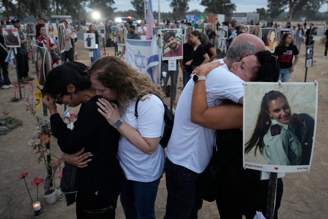 People visit the site of the Nova music festival, where hundreds of revelers were killed and abducted by Hamas and taken into Gaza, on the one-year anniversary of the attack, near Kibbutz Reim, southern Israel, Monday, Oct. 7, 2024. (AP Photo/Ariel Schalit) People visit the site of the Nova music festival, where hundreds of revelers were killed and abducted by Hamas and taken into Gaza, on the one-year anniversary of the attack, near Kibbutz Reim, southern Israel, Monday, Oct. 7, 2024. (AP Photo/Ariel Schalit)