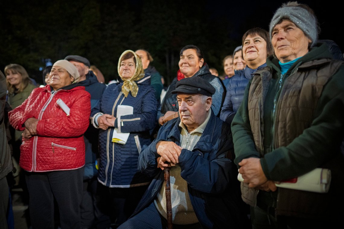 People listen to Moldova's President Maia Sandu speaking in Magdacesti, Moldova, Thursday, Oct. 17, 2024, as she seeks a second term in office ahead of a presidential election and a referendum of whether to enshrine in Moldova's Constitution its path to European Union membership taking place on Oct.20. (AP Photo/Vadim Ghirda) People listen to Moldova's President Maia Sandu speaking in Magdacesti, Moldova, Thursday, Oct. 17, 2024, as she seeks a second term in office ahead of a presidential election and a referendum of whether to enshrine in Moldova's Constitution its path to European Union membership taking place on Oct.20. (AP Photo/Vadim Ghirda)
