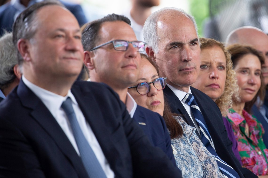 FILE - Second gentleman Doug Emhoff from left, Pennsylvania Governor Josh Shapiro, Carole Zawatsky, CEO of The Tree of Life, Sen. Bob Casey, Jr., D-Pa., Rep. Debbie Wasserman Schultz, D-Fla., and others listen during a groundbreaking ceremony for the new Tree of Life complex in Pittsburgh, Sunday, June 23, 2024. (AP Photo/Rebecca Droke) FILE - Second gentleman Doug Emhoff from left, Pennsylvania Governor Josh Shapiro, Carole Zawatsky, CEO of The Tree of Life, Sen. Bob Casey, Jr., D-Pa., Rep. Debbie Wasserman Schultz, D-Fla., and others listen during a groundbreaking ceremony for the new Tree of Life complex in Pittsburgh, Sunday, June 23, 2024. (AP Photo/Rebecca Droke)